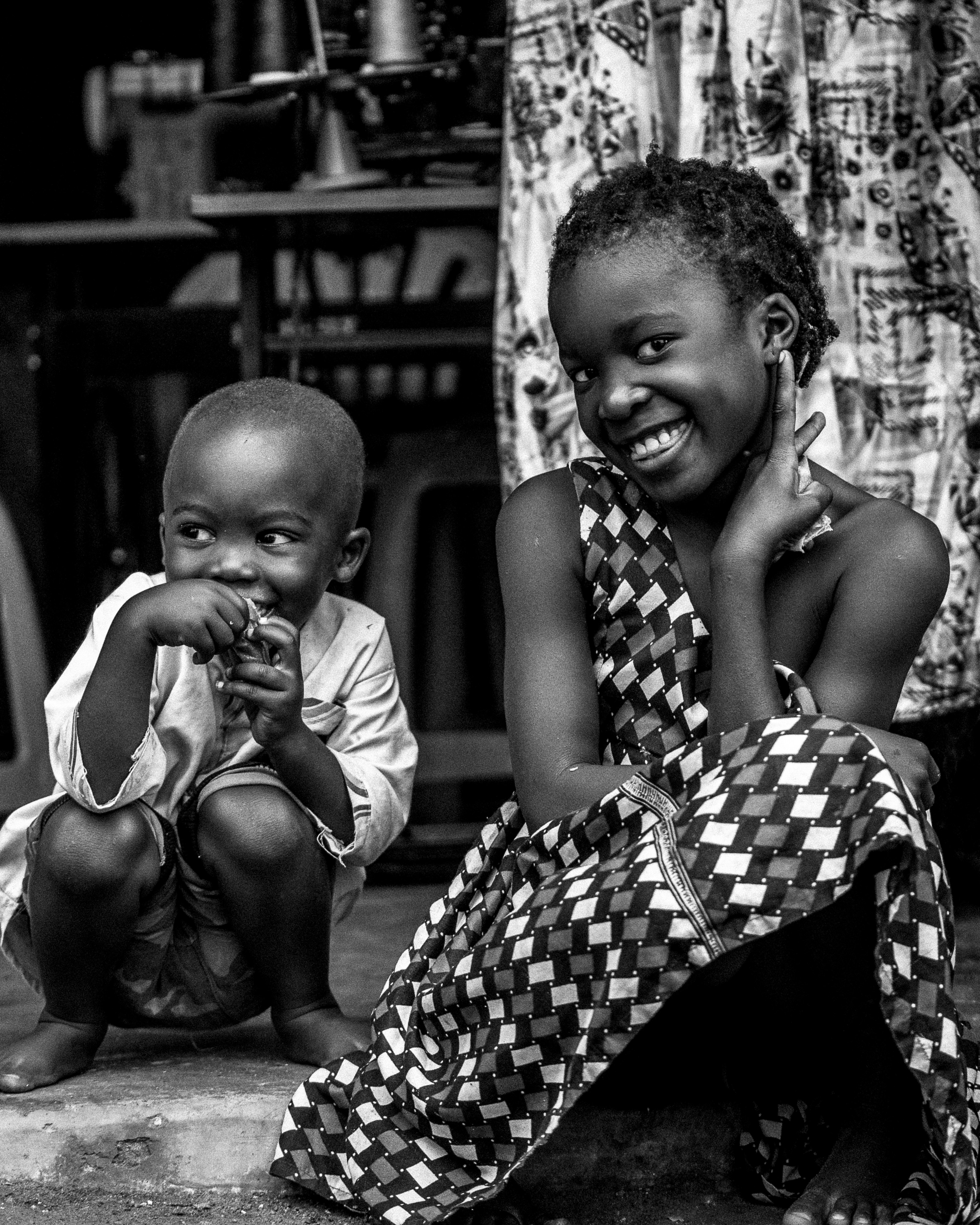 Two young girls laughing in Bweya, Uganda